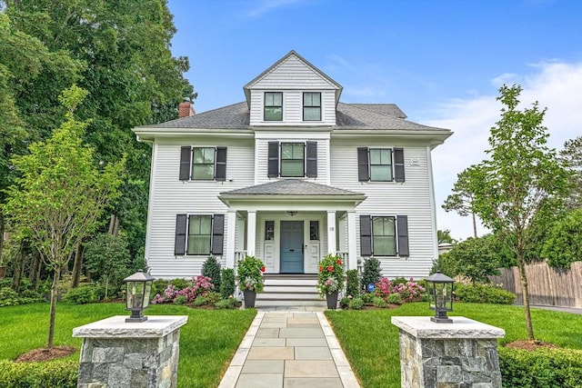 view of front of house with a front lawn