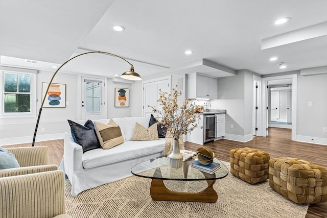 living room featuring hardwood / wood-style floors and wine cooler