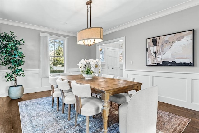 dining room with ornamental molding and dark wood-type flooring