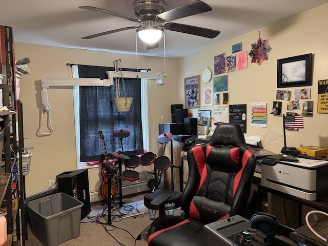 home office with a ceiling fan and baseboard heating