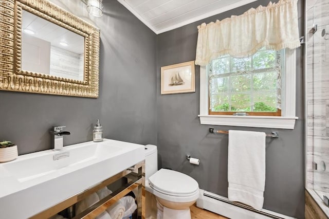 15 Youngs Rd, Gloucester, MA 01930 - bathroom with a baseboard radiator, toilet, vanity, an enclosed shower, and crown molding