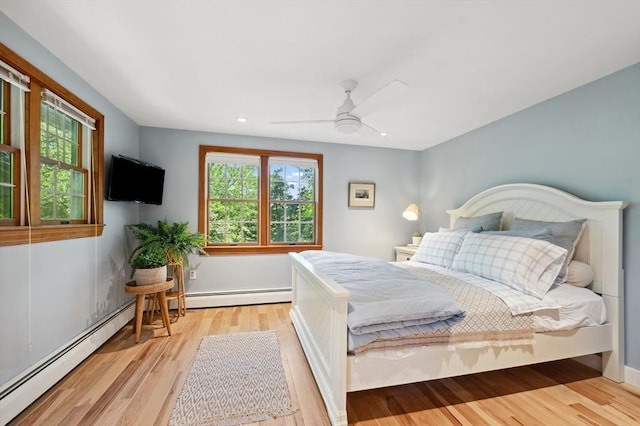 15 Youngs Rd, Gloucester, MA 01930 - bedroom with multiple windows, light wood-style floors, a baseboard heating unit, ceiling fan, and recessed lighting