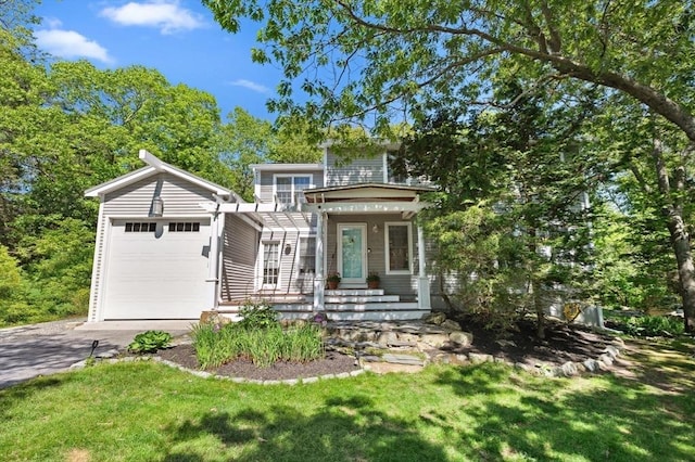 15 Youngs Rd, Gloucester, MA 01930 - view of front of property with driveway, an attached garage, and a front yard