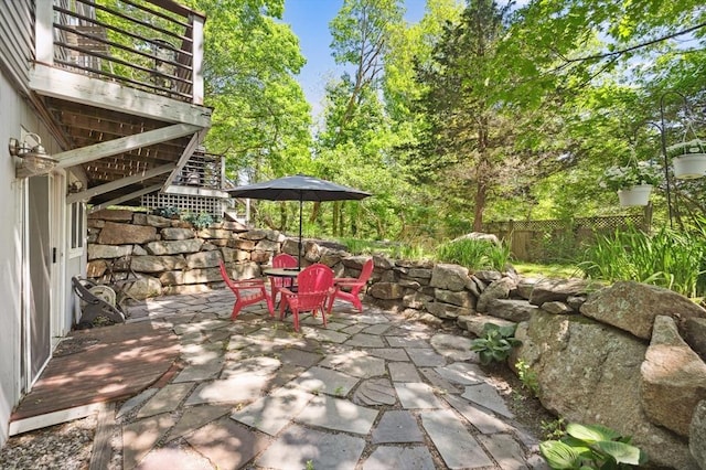 15 Youngs Rd, Gloucester, MA 01930 - fenced backyard featuring outdoor dining space, a patio, and stairs