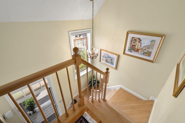 27 Quarryridge Ln Unit 27, Rockport, MA 01966 - stairs with a chandelier, wood finished floors, and lofted ceiling