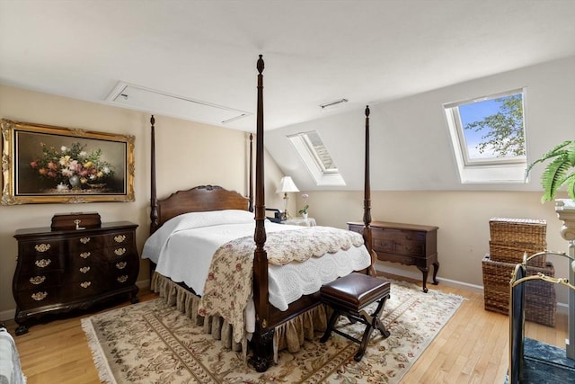 27 Quarryridge Ln Unit 27, Rockport, MA 01966 - bedroom with attic access, a skylight, multiple windows, and light wood finished floors