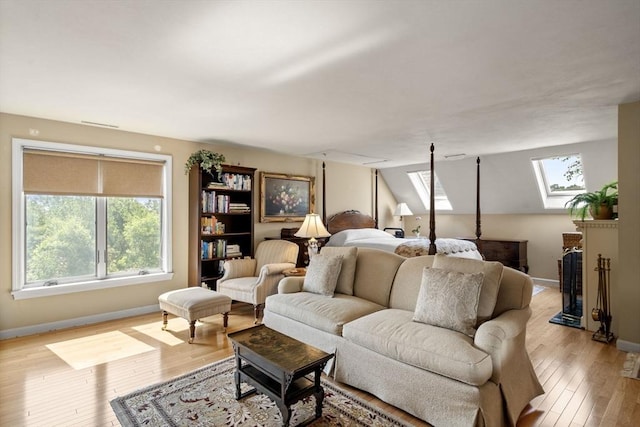 27 Quarryridge Ln Unit 27, Rockport, MA 01966 - bedroom with multiple windows, a skylight, and light wood-style floors