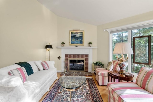 27 Quarryridge Ln Unit 27, Rockport, MA 01966 - living area with lofted ceiling and a fireplace