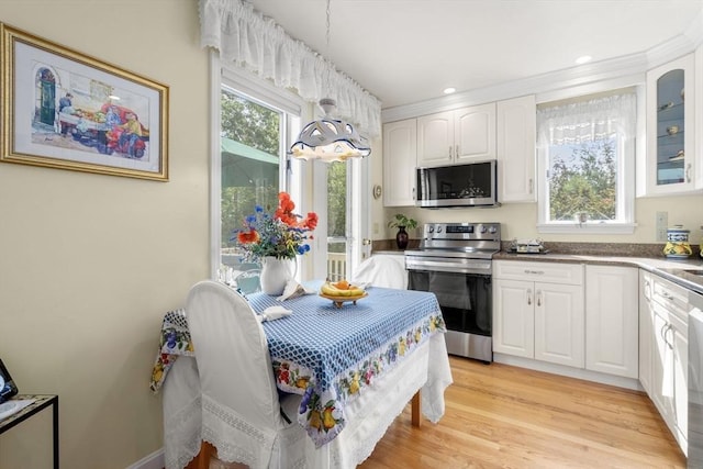 27 Quarryridge Ln Unit 27, Rockport, MA 01966 - kitchen with stainless steel appliances, white cabinetry, hanging light fixtures, glass insert cabinets, and recessed lighting