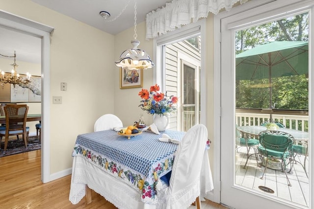 27 Quarryridge Ln Unit 27, Rockport, MA 01966 - dining space with a chandelier and light wood finished floors