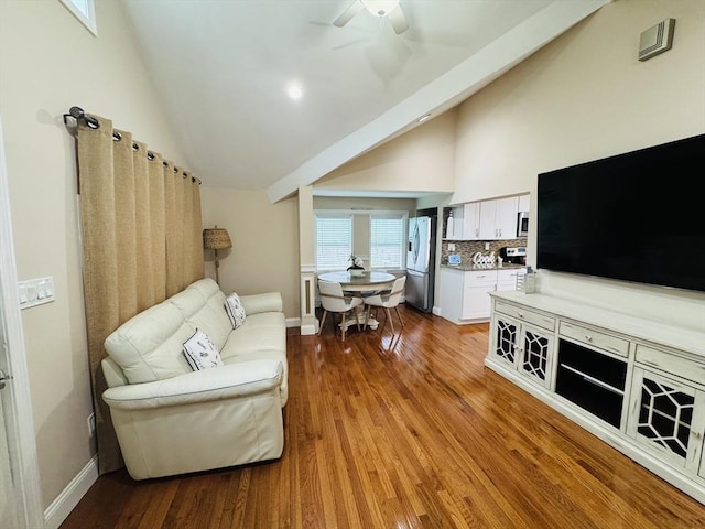 16 3rd St, Framingham, MA 01702 - living room with wood finished floors, a ceiling fan, and high vaulted ceiling