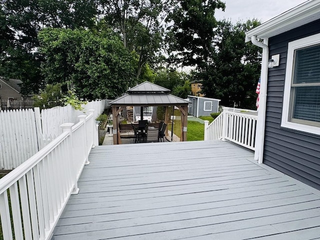 16 3rd St, Framingham, MA 01702 - deck with a gazebo, a fenced backyard, and a storage shed