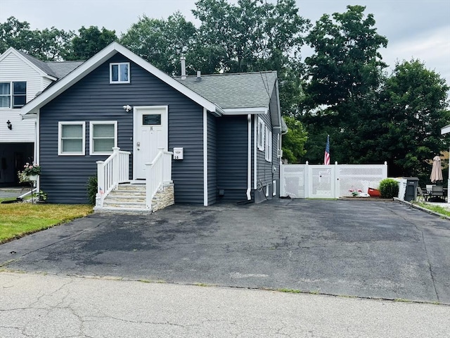 16 3rd St, Framingham, MA 01702 - bungalow with a shingled roof and asphalt driveway