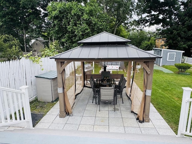16 3rd St, Framingham, MA 01702 - view of patio featuring a storage shed, a gazebo, and outdoor dining space
