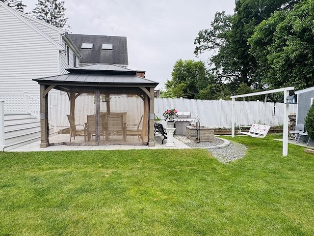 16 3rd St, Framingham, MA 01702 - fenced backyard with a gazebo and a patio area