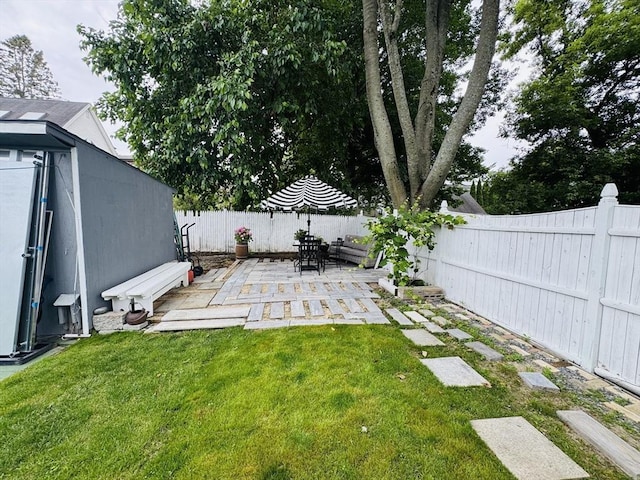 16 3rd St, Framingham, MA 01702 - fenced backyard with a patio