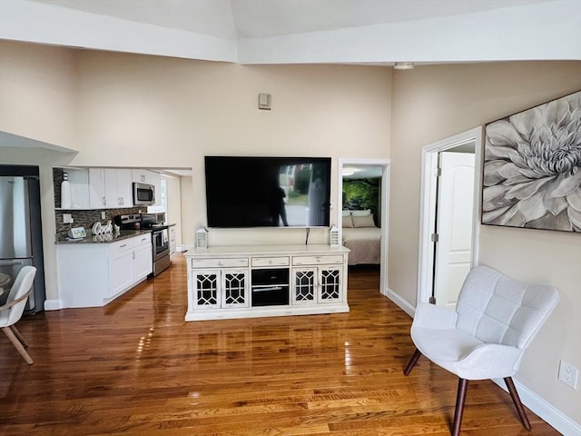 16 3rd St, Framingham, MA 01702 - living room with high vaulted ceiling and wood finished floors