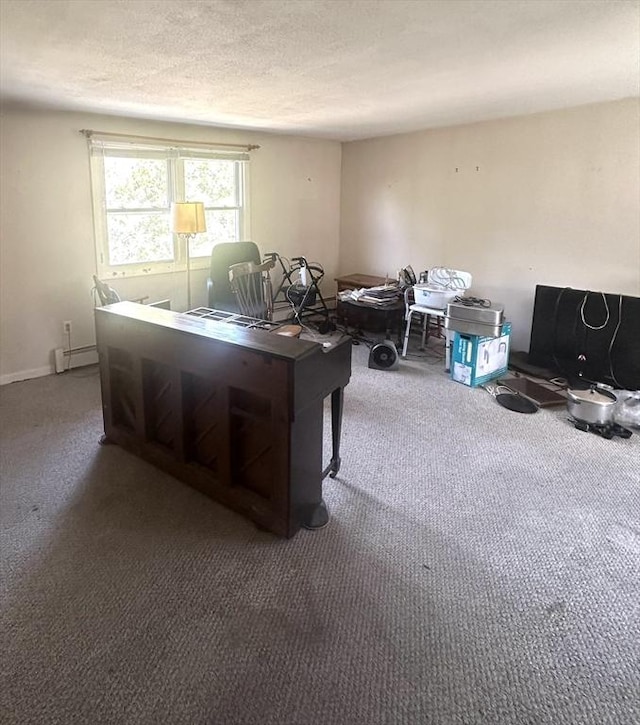 carpeted home office featuring a baseboard heating unit and a textured ceiling