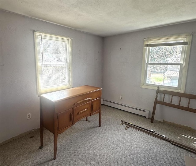 home office with carpet and baseboard heating