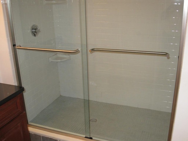 bathroom with a shower stall