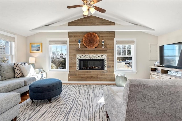 living area with plenty of natural light and vaulted ceiling