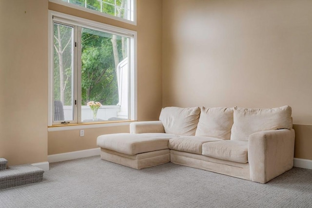 sitting room with carpet floors and baseboards