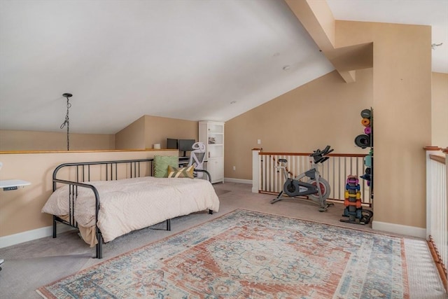 carpeted bedroom with baseboards and vaulted ceiling