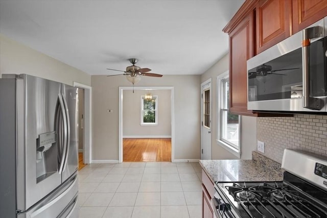 88 Cocasset St Unit 1, Foxboro, MA 02035 - kitchen featuring stainless steel appliances, ceiling fan, backsplash, and light tile patterned floors