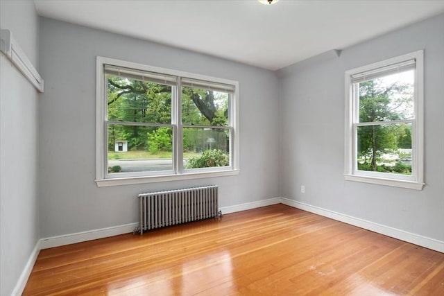 88 Cocasset St Unit 1, Foxboro, MA 02035 - unfurnished room with radiator heating unit, light wood-style floors, and baseboards