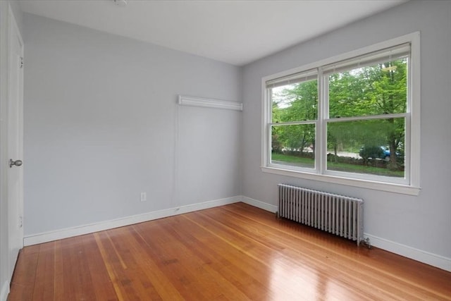 88 Cocasset St Unit 1, Foxboro, MA 02035 - spare room featuring radiator heating unit, wood finished floors, and baseboards