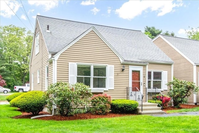 88 Cocasset St Unit 1, Foxboro, MA 02035 - view of front of house with a front lawn and a shingled roof