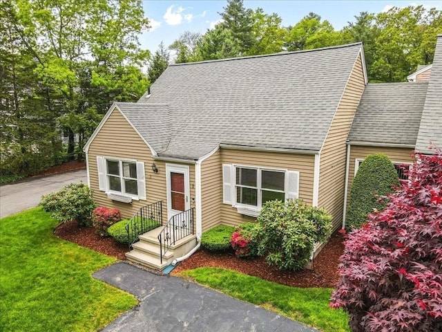 88 Cocasset St Unit 1, Foxboro, MA 02035 - cape cod home with a shingled roof and a front lawn