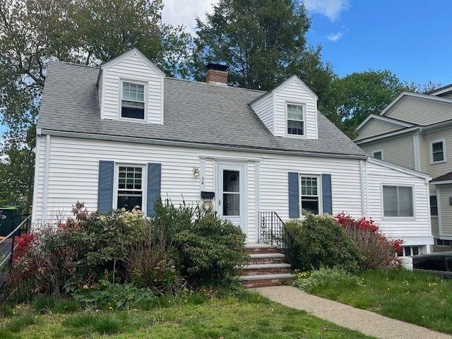 54 Hawthorn Ave, Needham, MA 02492 - new england style home featuring a chimney, a shingled roof, and a front lawn