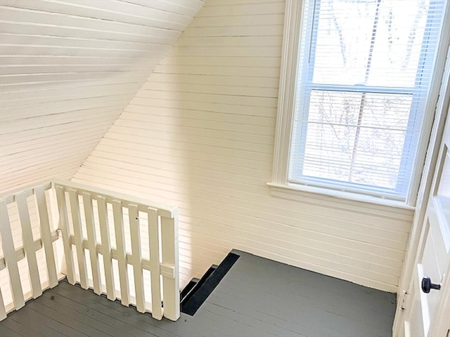 stairs featuring hardwood / wood-style flooring