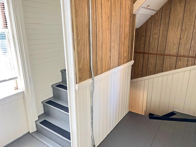 stairs with wood walls