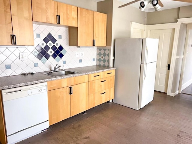 kitchen featuring white appliances, light brown cabinetry, ceiling fan, and a sink