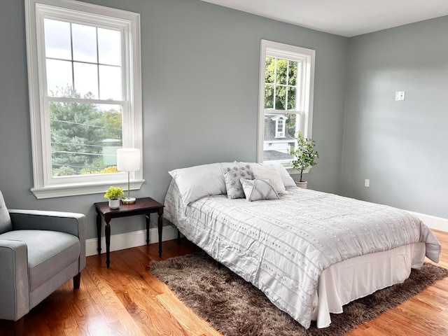 bedroom with wood-type flooring