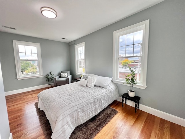 bedroom with wood-type flooring