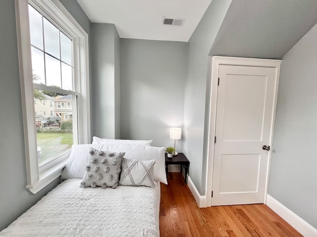 bedroom with light hardwood / wood-style floors