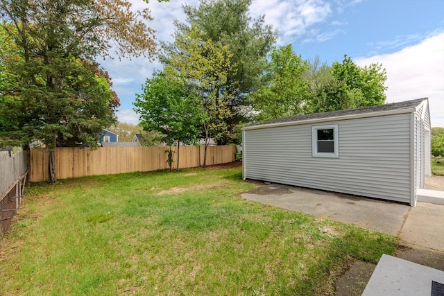 view of yard with a patio and an outdoor structure