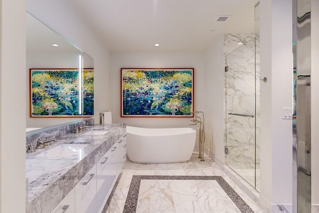 bathroom with vanity and independent shower and bath