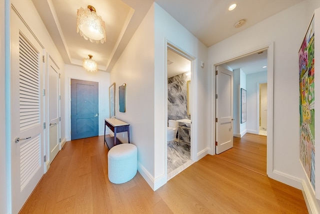 corridor featuring light hardwood / wood-style floors