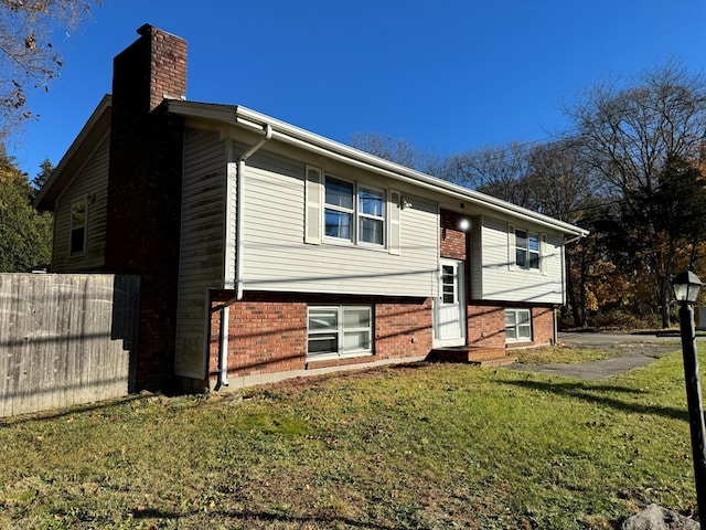 bi-level home with a front yard