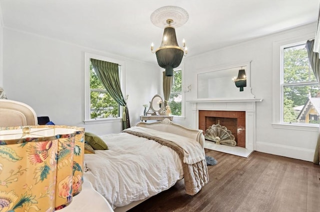 929 Beacon St, Newton, MA 02459 - bedroom with multiple windows, wood finished floors, and a brick fireplace