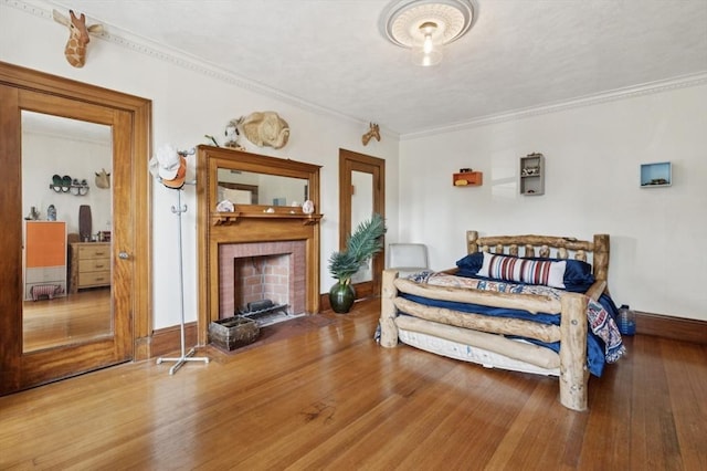 929 Beacon St, Newton, MA 02459 - bedroom featuring wood finished floors, ornamental molding, and a fireplace