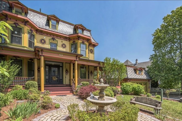 929 Beacon St, Newton, MA 02459 - back of house with mansard roof, covered porch, and a high end roof