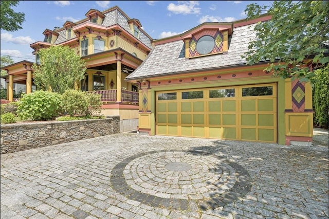 929 Beacon St, Newton, MA 02459 - view of front of home featuring mansard roof, a high end roof, and a garage