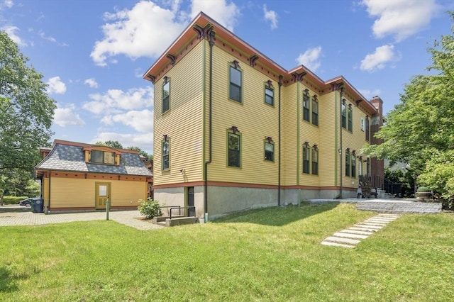 929 Beacon St, Newton, MA 02459 - rear view of house featuring a yard