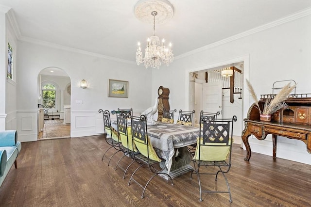 929 Beacon St, Newton, MA 02459 - dining room with arched walkways, wood finished floors, crown molding, a chandelier, and wainscoting