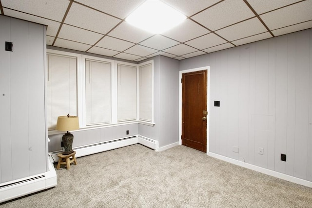 interior space featuring baseboard heating and light carpet